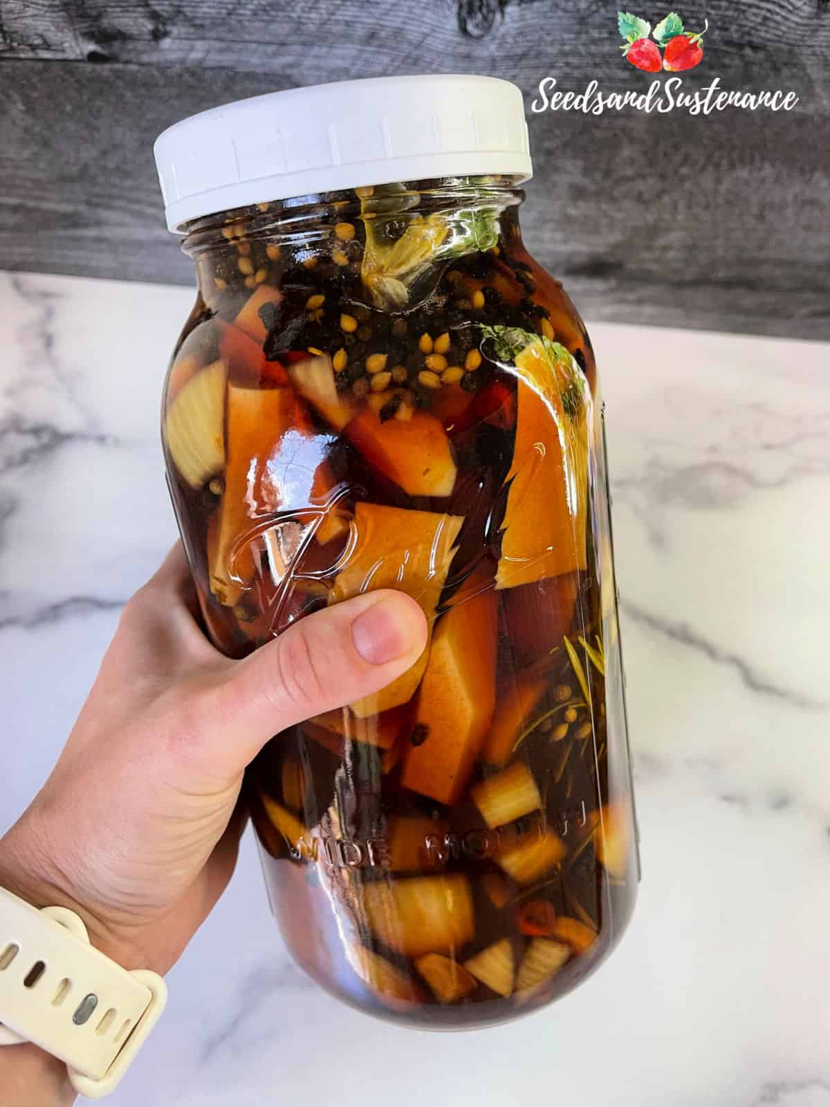 A finished jar of elderberry fire cider